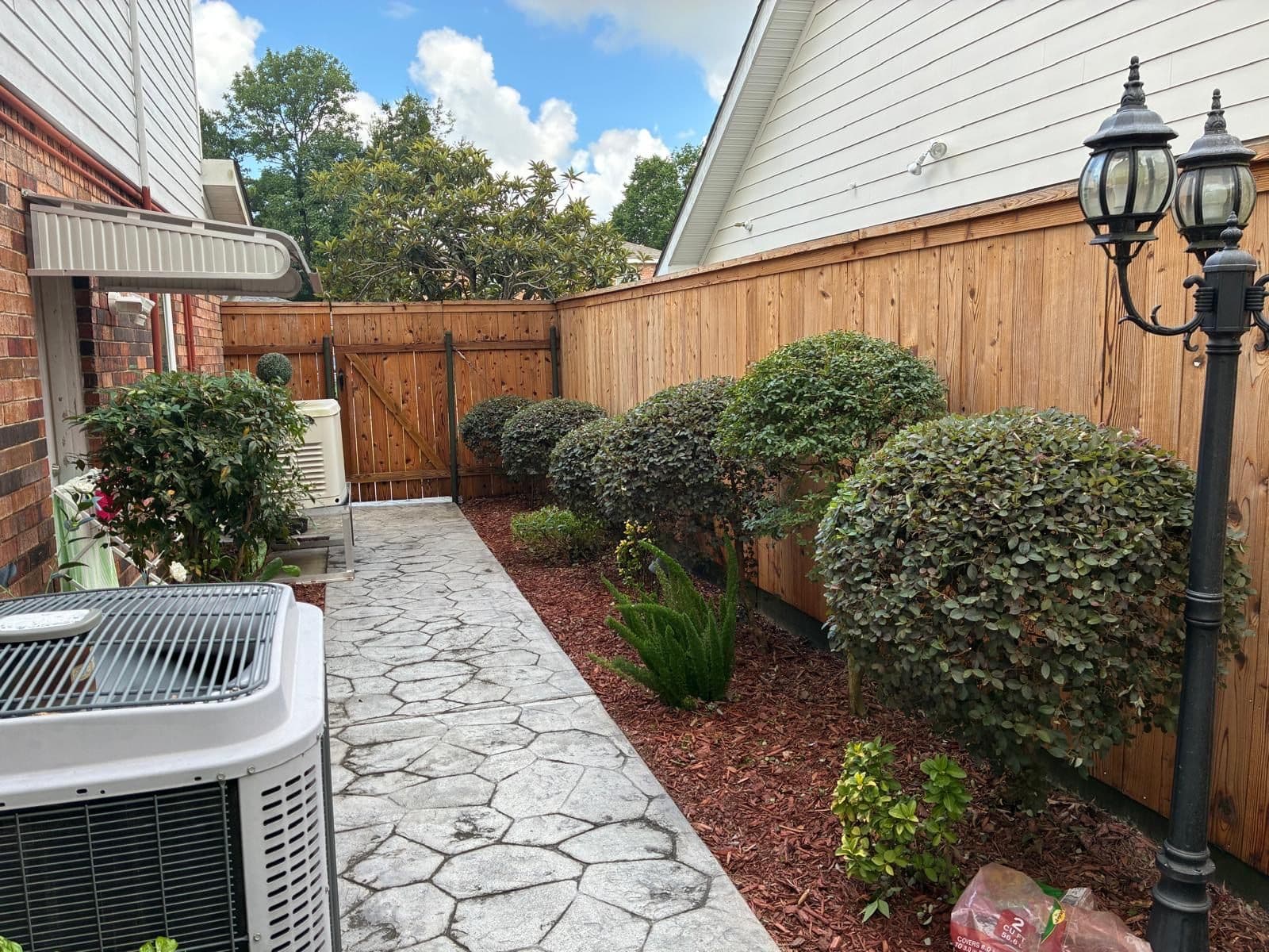 Wood privacy fence and landscaped side yard
